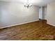 Bright dining room with hardwood floors and elegant chandelier at 209 Vermont Dr, Stanley, NC 28164