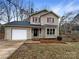 Two-story house with attached garage and landscaping at 209 Vermont Dr, Stanley, NC 28164