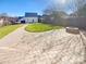 Large backyard with fire pit, patio, and detached garage at 2219 Lochview St, Pineville, NC 28134