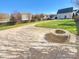 Large backyard with firepit and patio area at 2219 Lochview St, Pineville, NC 28134