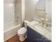 Bathroom with blue vanity, marble countertop and bathtub at 2219 Lochview St, Pineville, NC 28134