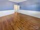 Spacious bedroom with hardwood floors and blue walls at 2219 Lochview St, Pineville, NC 28134