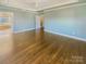 Main bedroom with hardwood floors and an ensuite bathroom at 2219 Lochview St, Pineville, NC 28134