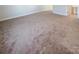 Spacious bedroom with neutral carpet and access to bathroom at 2219 Lochview St, Pineville, NC 28134