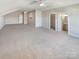 Large bedroom featuring carpet, ceiling fan, and ensuite bathroom at 2219 Lochview St, Pineville, NC 28134