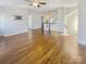 Large bonus room with hardwood floors and a staircase at 2219 Lochview St, Pineville, NC 28134