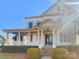 Two-story white house with a classic front porch at 2219 Lochview St, Pineville, NC 28134