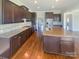 Modern kitchen with granite countertops and hardwood floors at 2219 Lochview St, Pineville, NC 28134