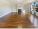 Bright living room featuring hardwood floors and fireplace at 2219 Lochview St, Pineville, NC 28134