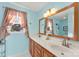 Double vanity bathroom with light blue walls at 320 Belwood Dr, Belmont, NC 28012