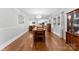 Bright dining room features hardwood floors and a view of the kitchen at 320 Belwood Dr, Belmont, NC 28012