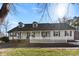 White ranch house with a spacious front yard and picket fence at 320 Belwood Dr, Belmont, NC 28012