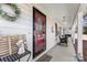 Inviting front porch with rocking chairs and red front door at 320 Belwood Dr, Belmont, NC 28012