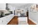 White kitchen with granite countertops and stainless steel appliances at 320 Belwood Dr, Belmont, NC 28012