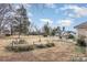 Large backyard with patio, garden space and mature trees at 3219 Monte Dr, Monroe, NC 28110