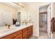 Bathroom with double sinks, wood cabinets, and a shower at 3219 Monte Dr, Monroe, NC 28110