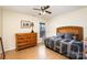 Bedroom with dresser, bed, and ceiling fan at 3219 Monte Dr, Monroe, NC 28110