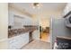 Kitchen with white cabinets, stainless steel appliances, and tile backsplash at 3219 Monte Dr, Monroe, NC 28110