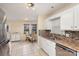 Bright kitchen with white cabinets, tile flooring, and a breakfast nook at 3219 Monte Dr, Monroe, NC 28110