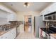 Updated kitchen with stainless steel appliances and tile backsplash at 3219 Monte Dr, Monroe, NC 28110