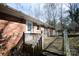 Backyard featuring a wooden deck, brick house, and natural light at 3303 Reid Cir, Monroe, NC 28112