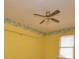 Bedroom featuring wallpaper border, ceiling fan, yellow walls, carpet, and one window at 3303 Reid Cir, Monroe, NC 28112