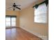 Bedroom with hardwood floors, natural light, and a ceiling fan with a light fixture at 3303 Reid Cir, Monroe, NC 28112