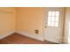 Bright room featuring laminate floors, white trim and door, and light yellow paint at 3303 Reid Cir, Monroe, NC 28112