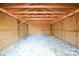 Interior view of a new storage shed with wood frame and gravel floor at 3303 Reid Cir, Monroe, NC 28112