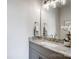 Elegant bathroom featuring a granite countertop, modern fixtures, and a decorative mirror at 3428 Greene Rd, Monroe, NC 28110