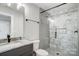 Modern bathroom featuring tiled shower, granite vanity top, and matte black hardware at 3428 Greene Rd, Monroe, NC 28110