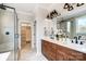 Elegant bathroom featuring a double sink vanity, glass shower, and walk-in closet at 3428 Greene Rd, Monroe, NC 28110