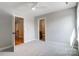 Well-lit bedroom featuring neutral carpeting and ensuite bathroom at 3428 Greene Rd, Monroe, NC 28110