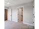 Bedroom featuring neutral carpeting and a walk-in closet, enhanced by natural light at 3428 Greene Rd, Monroe, NC 28110