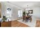 Bright dining room with hardwood floors, stylish decor, and ample natural light at 3428 Greene Rd, Monroe, NC 28110