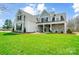 Attractive two-story home showcasing a lush green lawn and craftsman-inspired facade at 3428 Greene Rd, Monroe, NC 28110