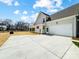 Exterior view of home with a large garage, yard, and convenient access at 3428 Greene Rd, Monroe, NC 28110