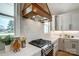 Modern kitchen with stainless steel range, quartz countertops, custom range hood, and recessed lighting at 3428 Greene Rd, Monroe, NC 28110