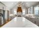 Bright kitchen with white countertops, modern cabinetry, and large island with stainless steel appliances at 3428 Greene Rd, Monroe, NC 28110