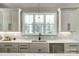 Kitchen featuring a large window, stainless steel dishwasher, modern countertops, and gray cabinets at 3428 Greene Rd, Monroe, NC 28110