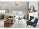 Inviting living room with a cozy fireplace, neutral decor, and lots of natural light at 3428 Greene Rd, Monroe, NC 28110