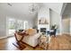 Cozy living room features a fireplace, hardwood floors, and large windows for natural light at 3428 Greene Rd, Monroe, NC 28110