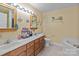 Bathroom with double vanity, bathtub, and updated fixtures at 36190 Millingport Rd, New London, NC 28127