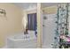 Bathroom with corner tub and walk-in shower at 36190 Millingport Rd, New London, NC 28127