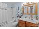 Clean bathroom with single vanity and shower/tub combo at 36190 Millingport Rd, New London, NC 28127