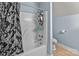 Bathroom with shower/tub and floral shower curtain at 36190 Millingport Rd, New London, NC 28127