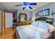 Bedroom with ceiling fan and wood dresser at 36190 Millingport Rd, New London, NC 28127