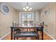 Bright dining room with hardwood floors and view to backyard at 36190 Millingport Rd, New London, NC 28127