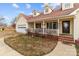 Detailed view of the home's exterior, highlighting the porch and entryway at 36190 Millingport Rd, New London, NC 28127