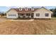 House exterior showcasing a ranch-style home with a front porch and attached garage at 36190 Millingport Rd, New London, NC 28127